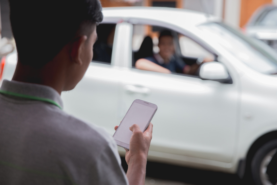 Customer Ordering Taxi via Online Apps